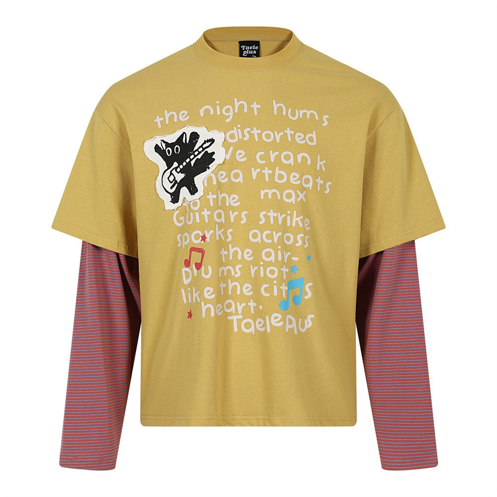 Oversized layered-look graphic long sleeve tee in mustard yellow with striped contrast sleeves and cat guitar patch on chest