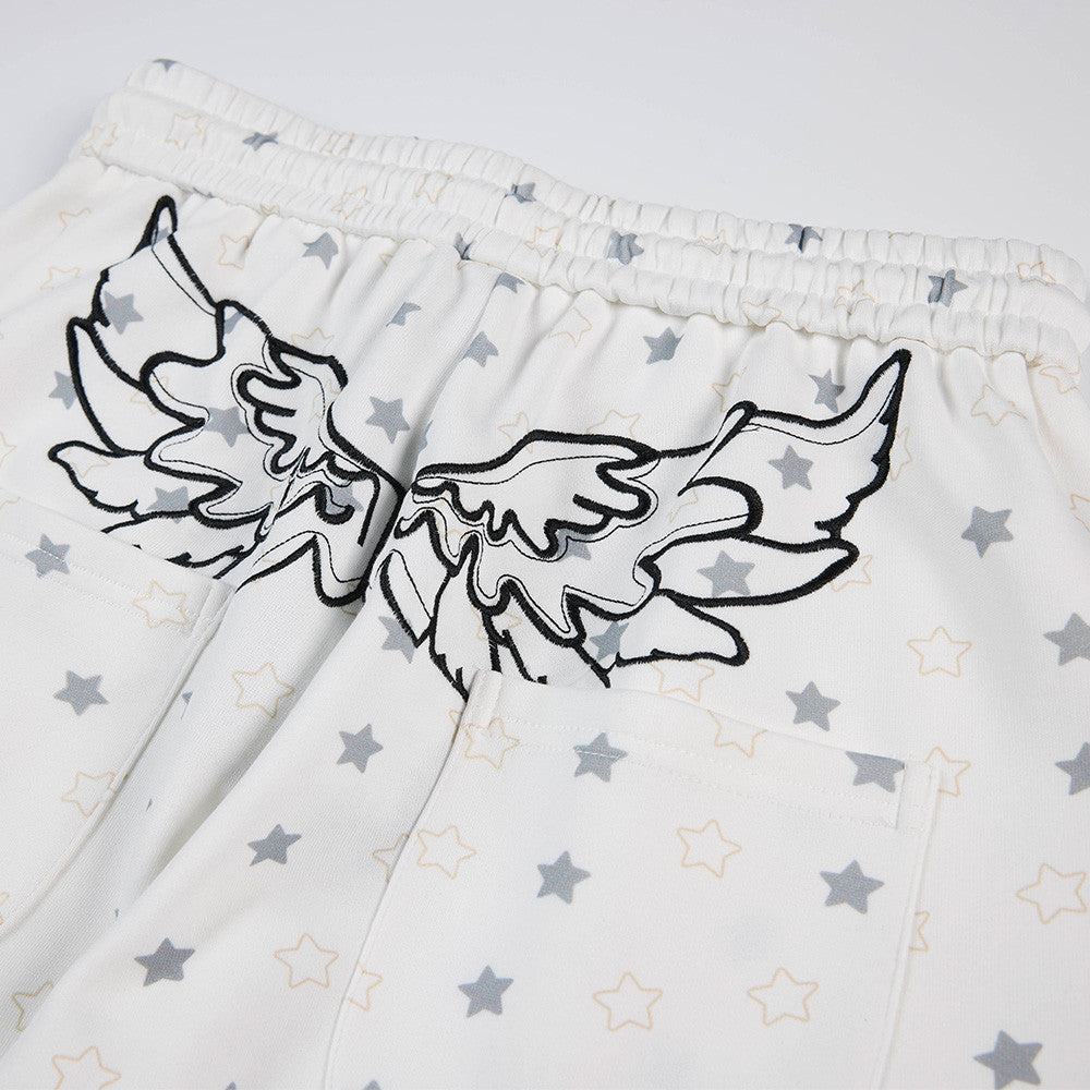 Pantalon de survêtement à jambes larges, imprimé étoiles, avec ailes d’ange et broderie de lettres