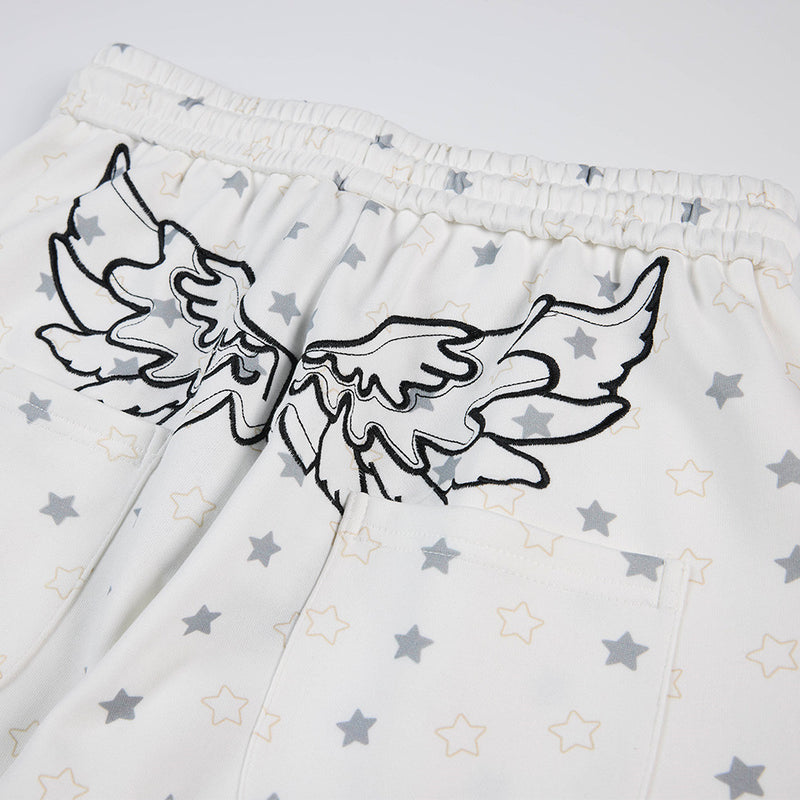 Pantalon de survêtement à jambes larges, imprimé étoiles, avec ailes d’ange et broderie de lettres