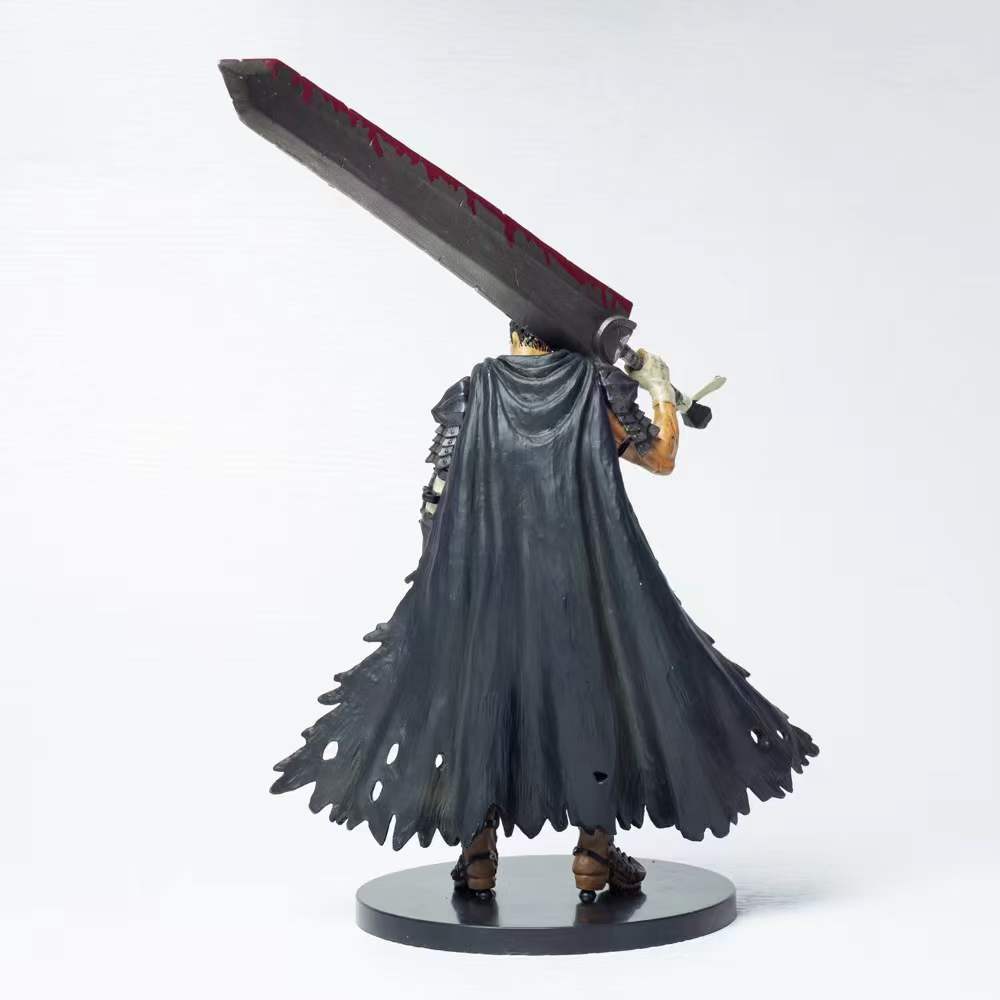 The Berserk Guts Brand Marked Bloodstained Version Action Figure features a detailed black cape and a bloodstained large sword resting over the shoulder. The back-facing 21 cm PVC statue highlights the intricate craftsmanship of its cloak and blade.