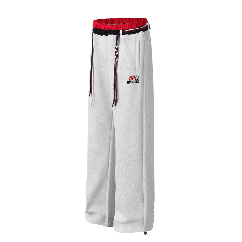 Pantalon de survêtement à jambes larges avec double ceinture et cordon tressé