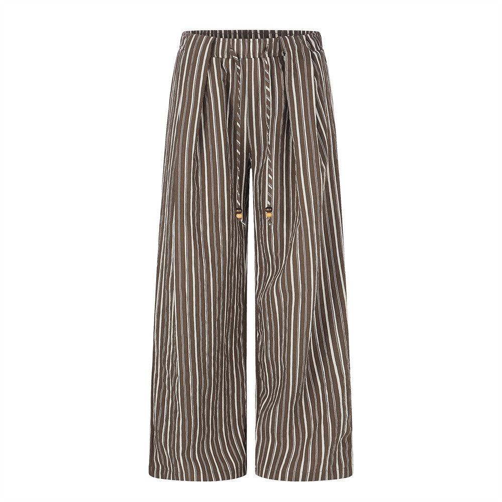 Wide-leg vertical stripe pants with elastic drawstring waist and wooden bead cord tips in brown colorway