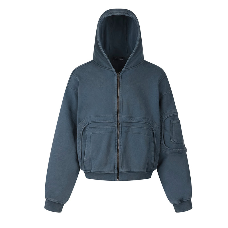 Veste à capuche zippée oversize bleu marine délavé, avec multiples poches à l’avant et poche sur la manche, finition vintage effet délavé à l’acide