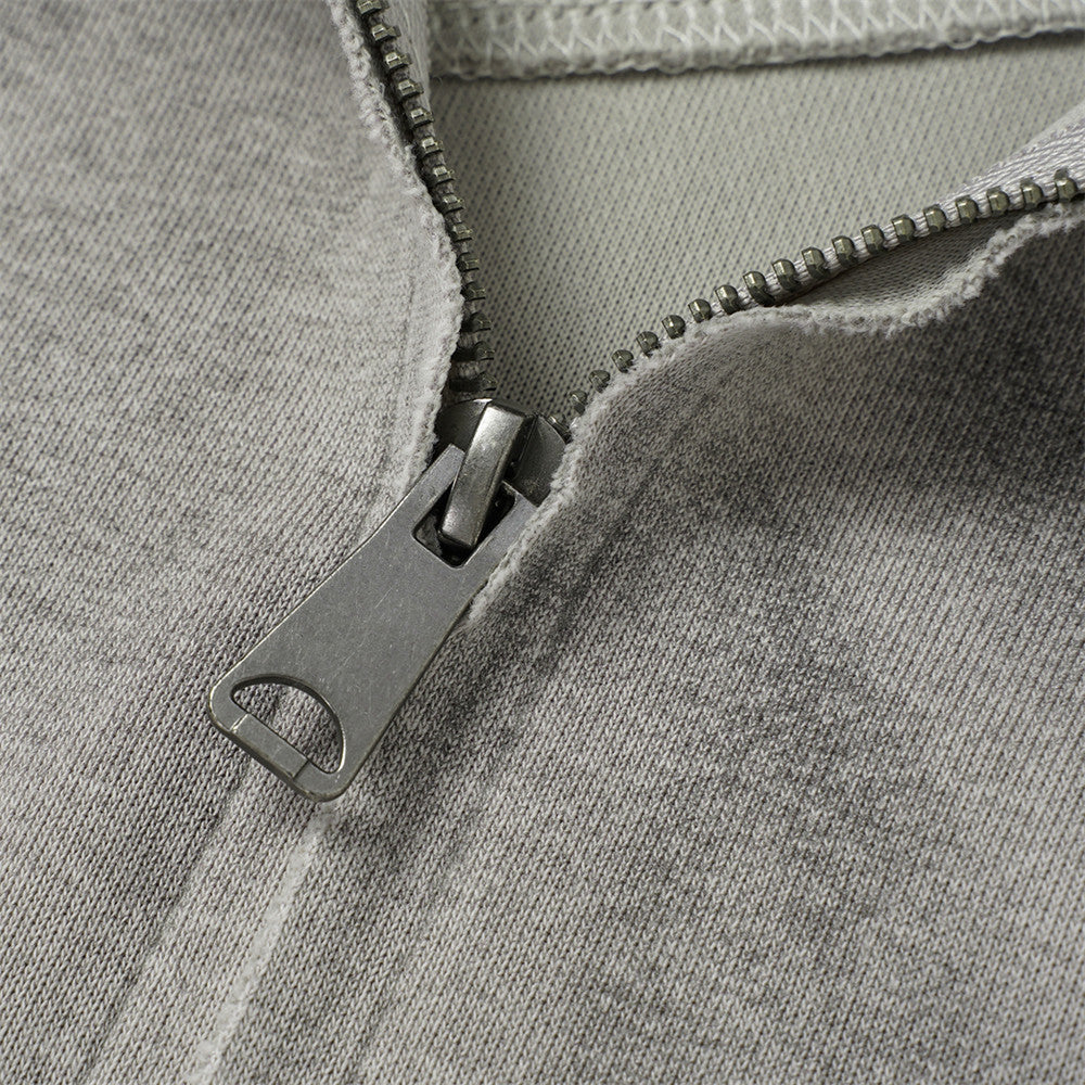 Sweat à capuche oversize zippé – Finition délavée usée, poches à multiples zips et bords bruts