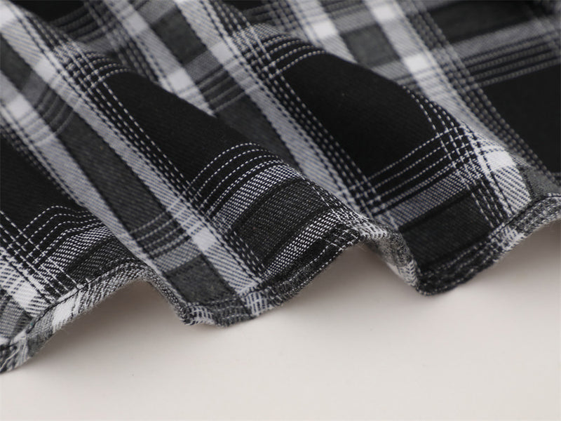 Close-up of black plaid flannel hem with soft curved edge