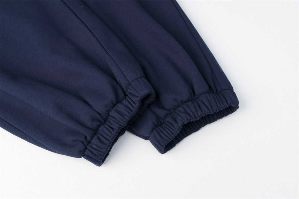 Pantalon de survêtement homme à jambes larges avec écusson brodé et imprimé graphique en écriture