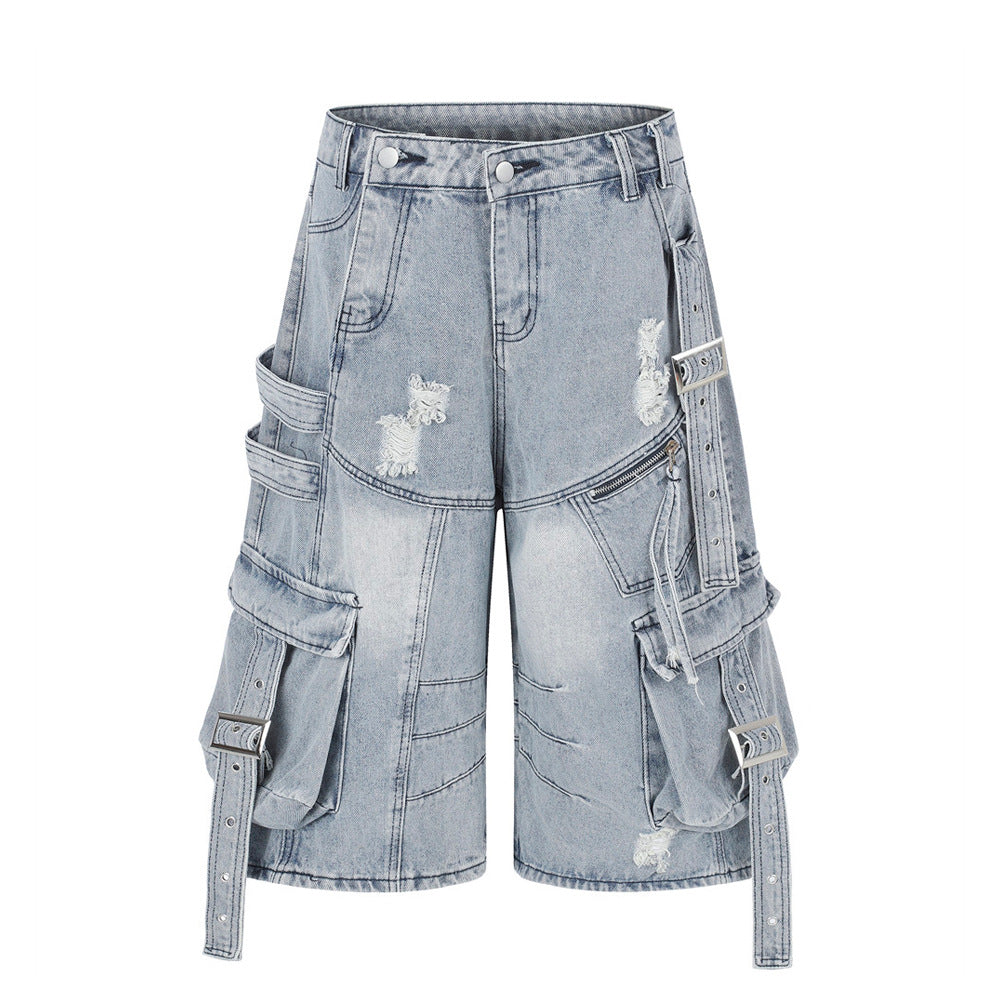 Deconstructed punk cargo denim shorts with multi-pocket buckle strap detail in light blue and dark grey wash