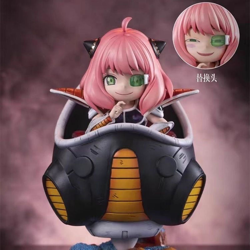 Inside a sleek, black pod trimmed with orange, the Spy x Family Anya Forger PVC Figure (15 cm) channels a playful espionage theme with cat ears and a green eyepiece. This pink-haired figure, cosplaying as Frieza, features double head replacement to showcase varying expressions.