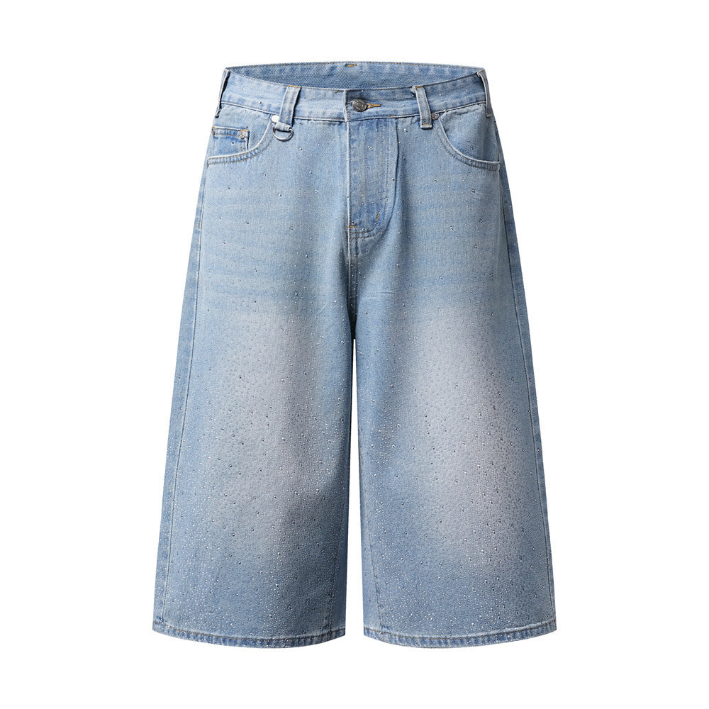 Men's wide-leg rhinestone denim Bermuda shorts in light blue vintage wash, front view showing scattered rhinestone embellishm
