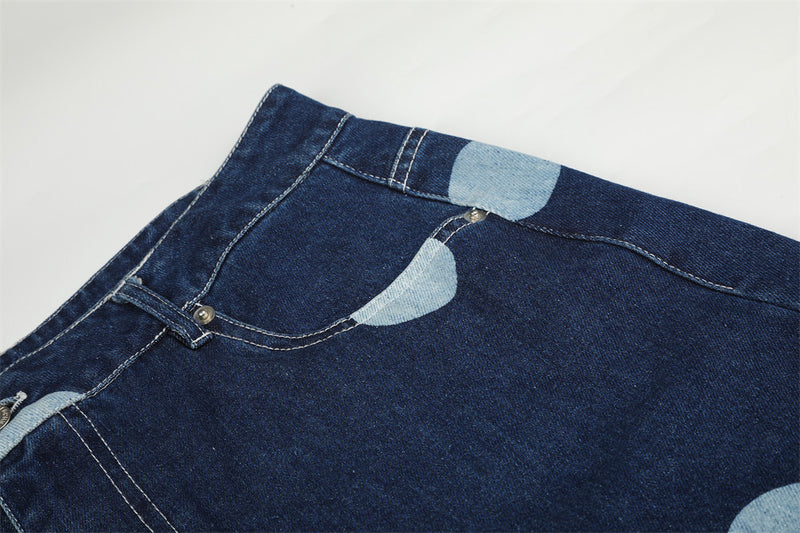Close-up of back waistband and top pocket area on polka dot jeans