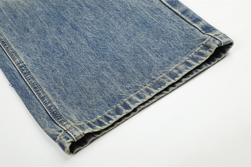 Jean homme coupe large – Denim délavé effet usé avec clous pyramidaux