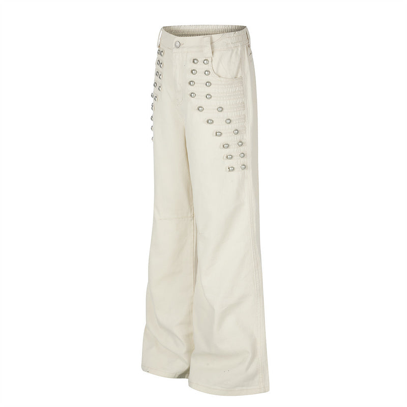 Pantalon homme coupe large orné de perles et de clous métalliques