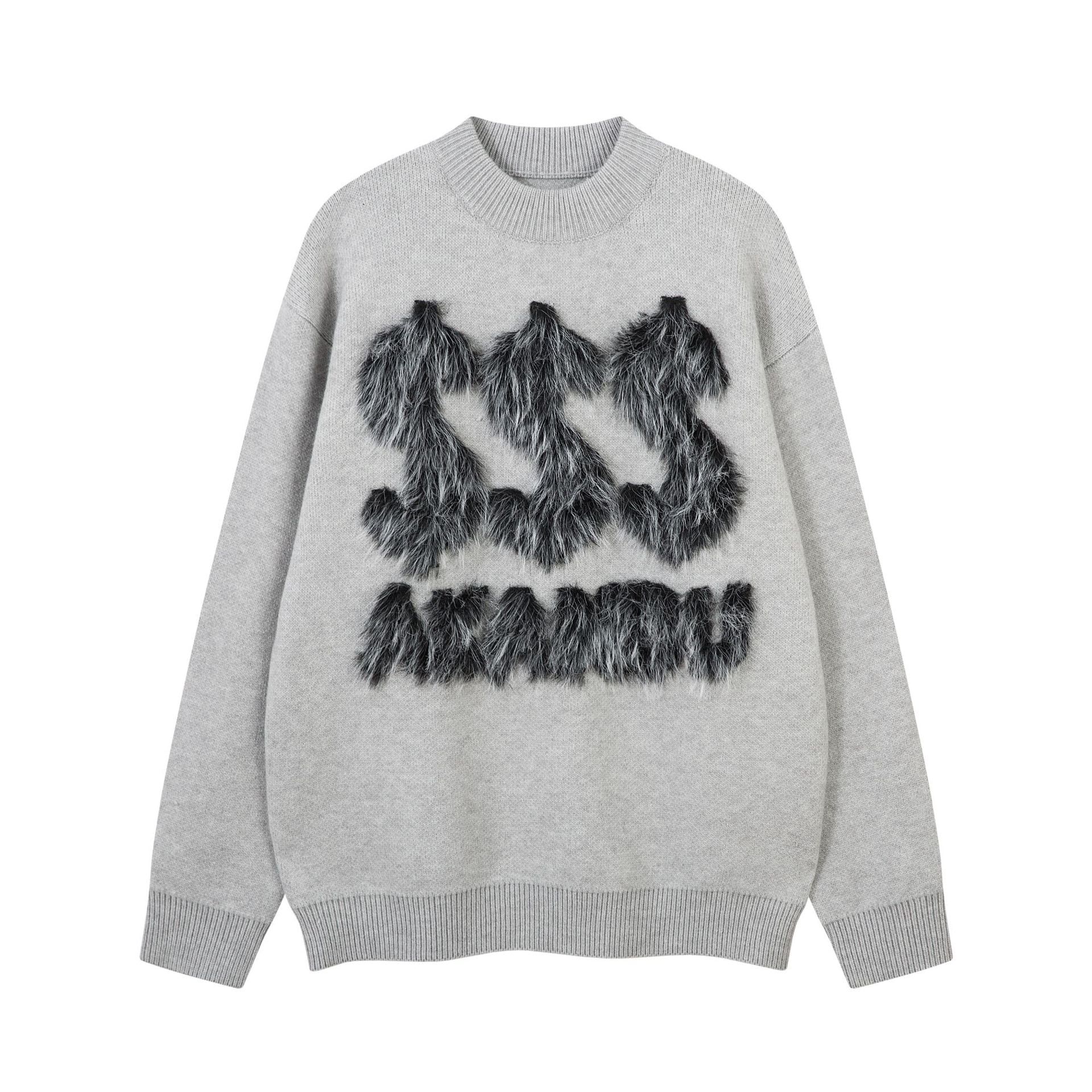 Pull oversize gris à col rond, appliqué en fausse fourrure noire formant une lettre et un motif dollar sur la poitrine, poignets et bas côtelés
