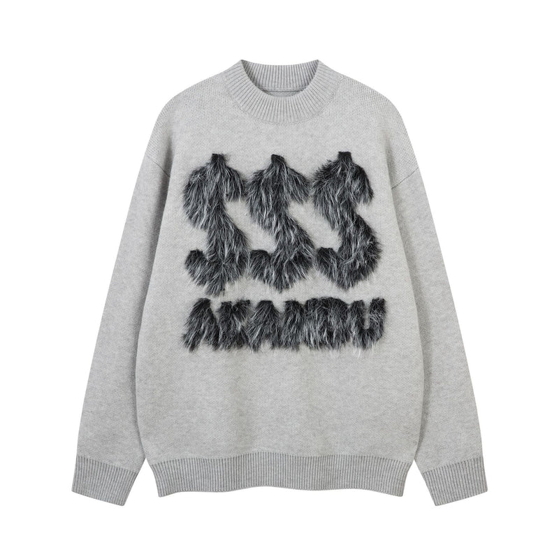 Pull oversize gris à col rond, appliqué en fausse fourrure noire formant une lettre et un motif dollar sur la poitrine, poignets et bas côtelés
