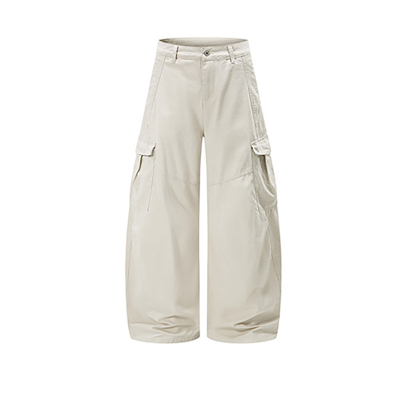 Cream wide-leg cargo pants with side flap pockets, front view