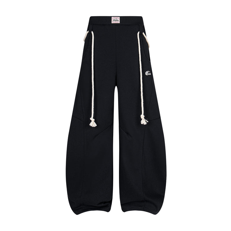 Battlekid Studio wide-leg sweatpants with cream rope drawstrings and curved seam paneling in black
