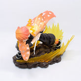 Explore the Demon Slayer Zenitsu Agatsuma Figure, a 14.5cm high-quality PVC collectible. This figure captures Zenitsu in his Thunder Breathing stance, showcasing orange hair and a patterned cloak while crouched with his sword on a brown rocky base, highlighted by dynamic yellow effects.