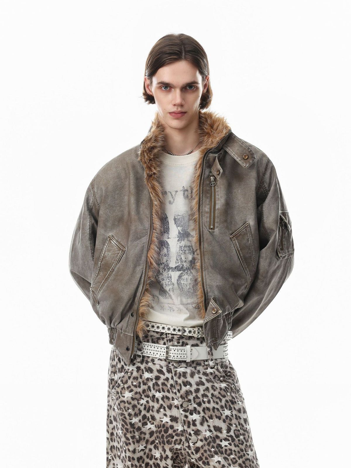 Oversized vintage washed bomber jacket with faux fur collar in charcoal grey, worn open over a graphic tee with leopard print