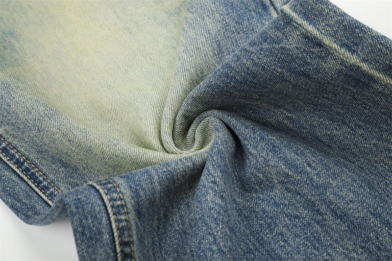 Jean homme coupe large – Denim délavé effet usé avec clous pyramidaux