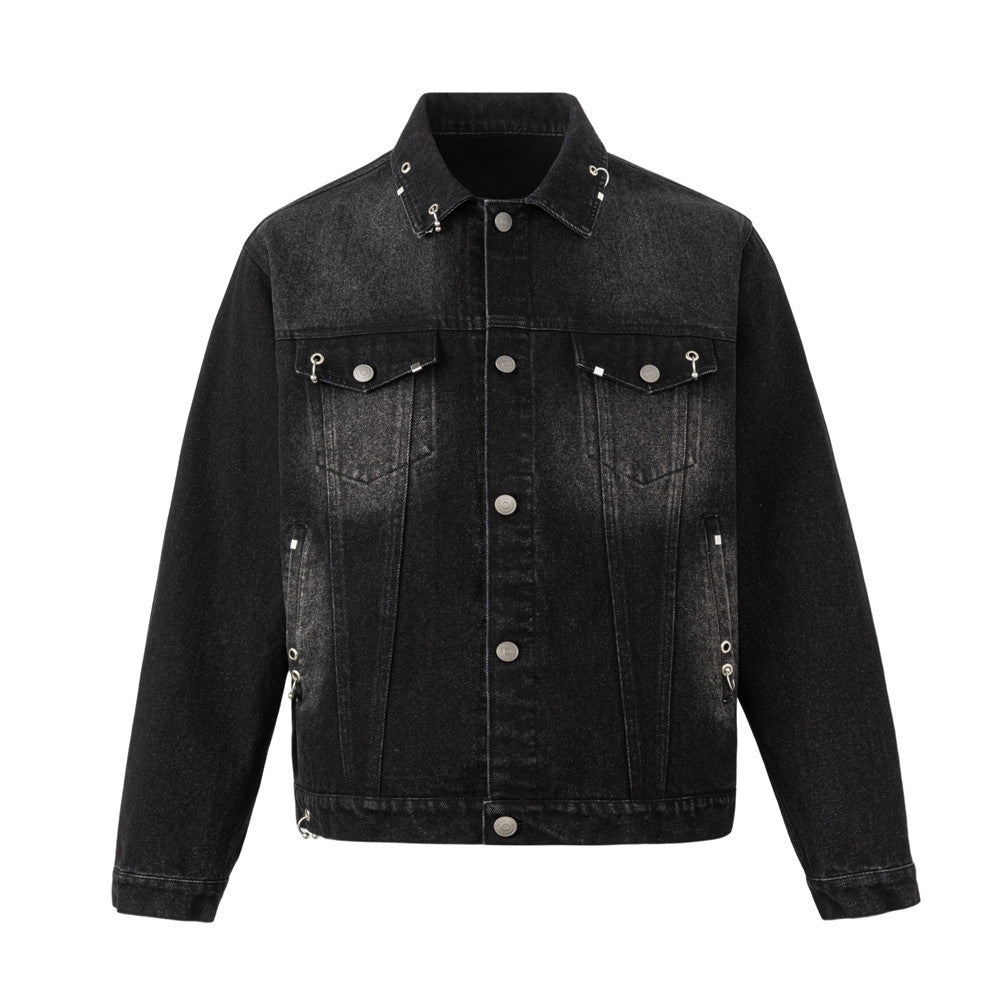 Men's washed black denim trucker jacket with silver metal ring and eyelet hardware at collar and chest pockets, front and bac
