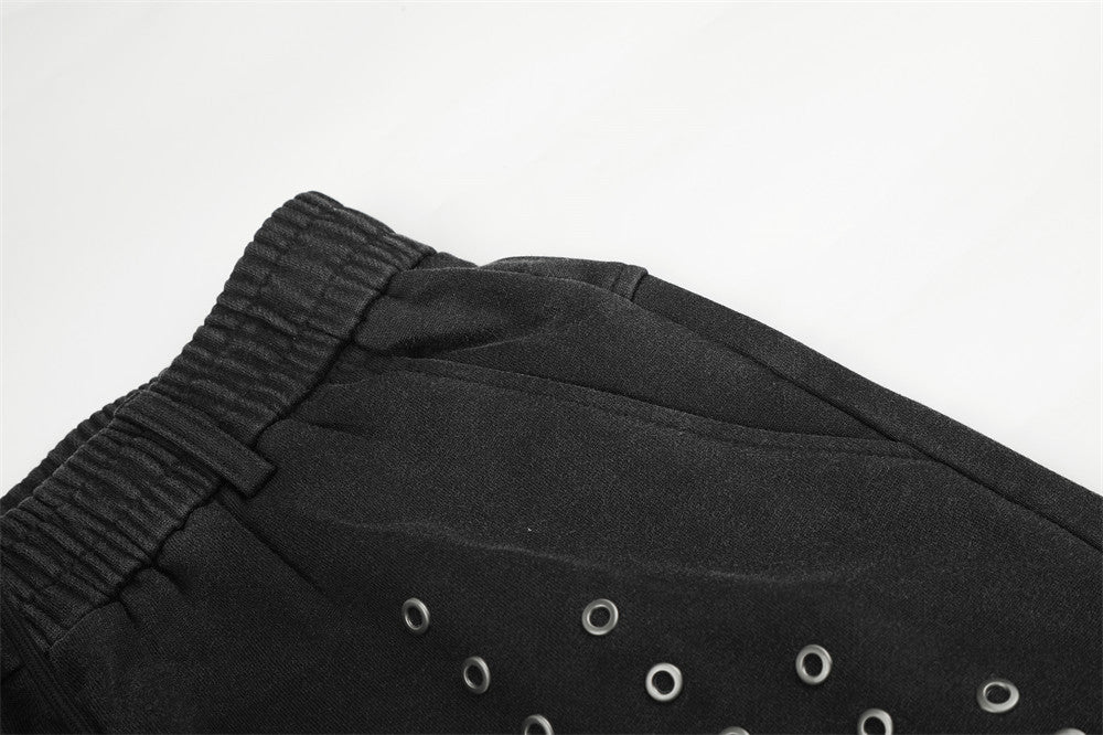 Pantalon de survêtement ample à œillets métalliques, finition délavée à l’acide & ourlet brut