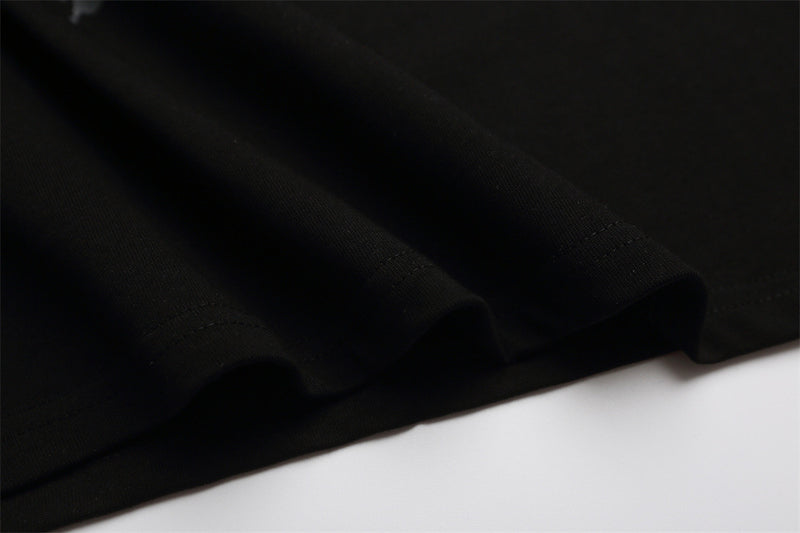 Black T-shirt hem and stitching close-up