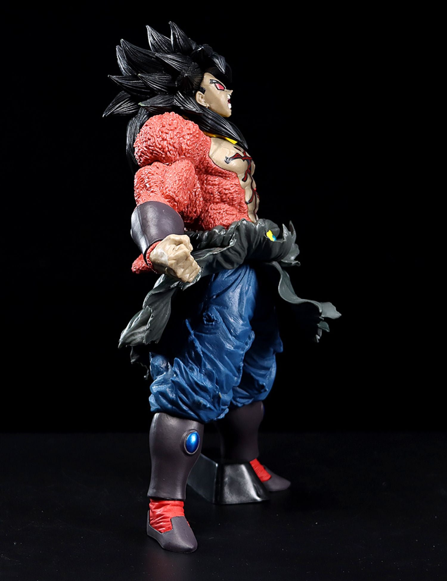 The Seakoff Super Saiyan Broly Collectible Figure, a 33cm premium Dragon Ball Z action figure, features striking spiky black hair, yellow eyes, red fur on the upper body, blue pants, and red shin guards set against a bold black background.