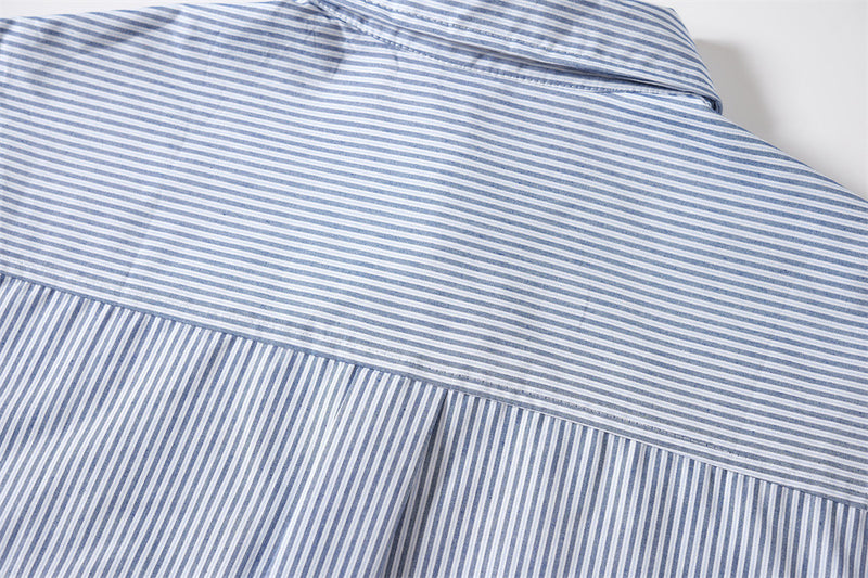 Close-up of the shirt back yoke with fine blue and white stripes