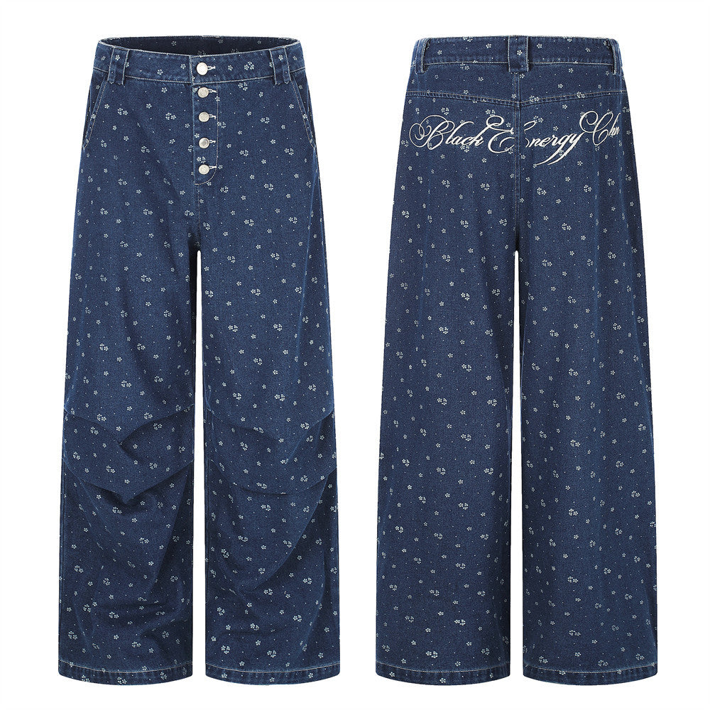 Dark blue wide-leg jeans front and back views with small floral print and script embroidery