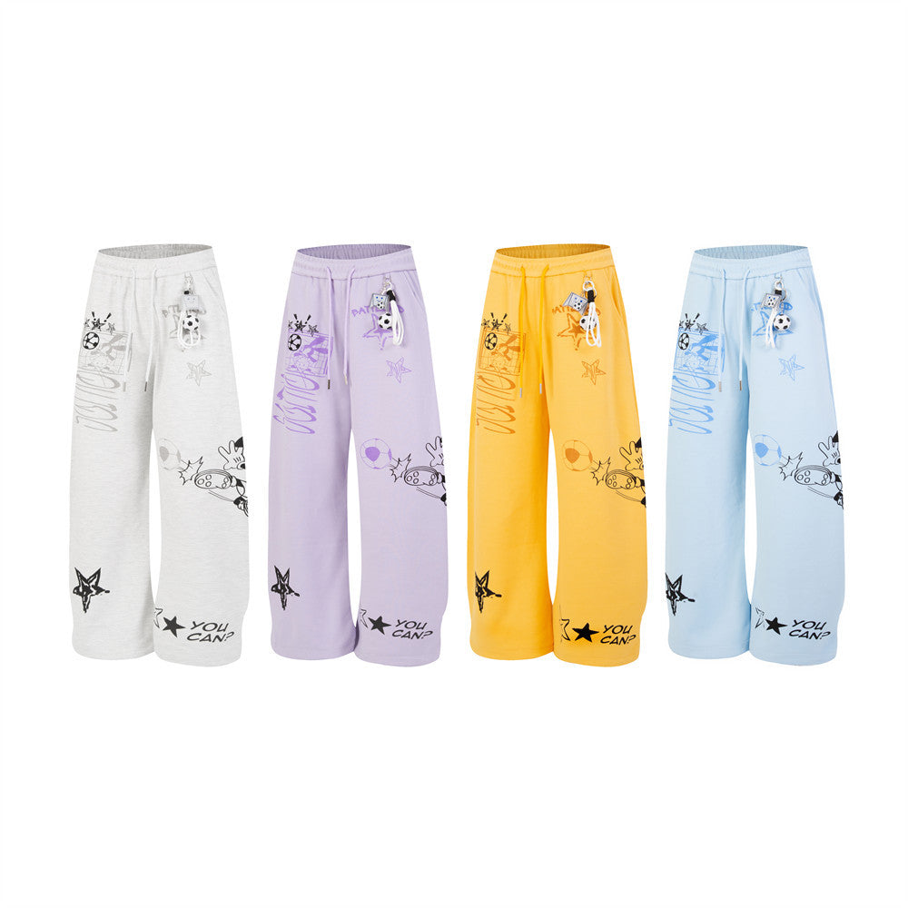 Wide-leg sweatpants with Mickey Mouse and soccer graphic print in lavender purple, shown front and back