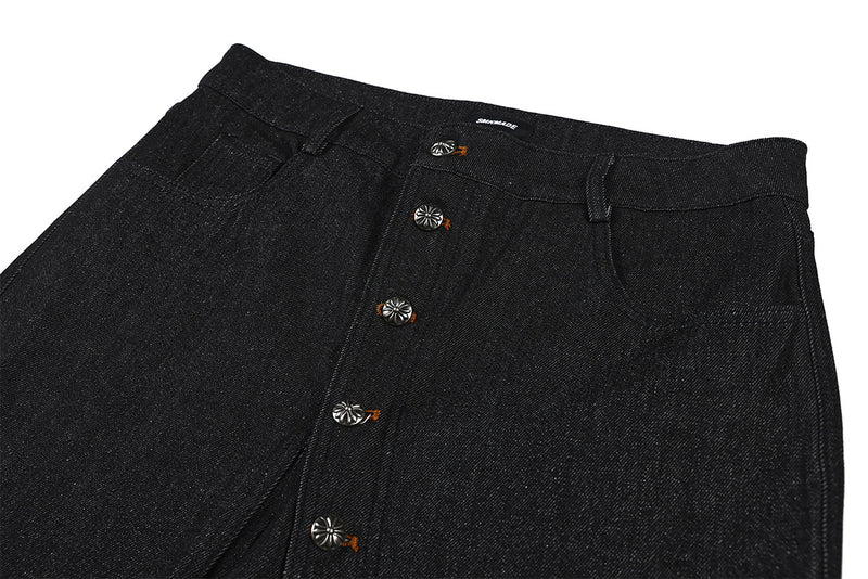 Jean droit noir brut à boutons-pression latéraux
