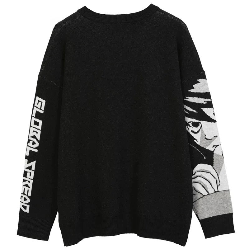 The Death Note Premium Knit Sweater features a black design with "GLOBAL FREAKED" in bold white on the left sleeve and a detailed grayscale depiction of Misa Amane's eyes and hand on the right sleeve.