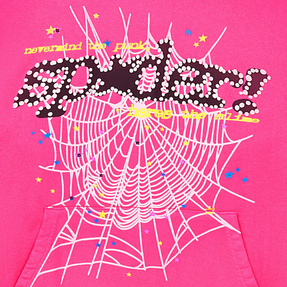 The Sp5der “Nevermind the Punk” Hoodie in hot pink features a bold "spider!" graphic above a white web, yellow stars, blue dots, and yellow text: never mind the pink, heres the web. 440GSM heavyweight streetwear pullover with true Y2K vibes.