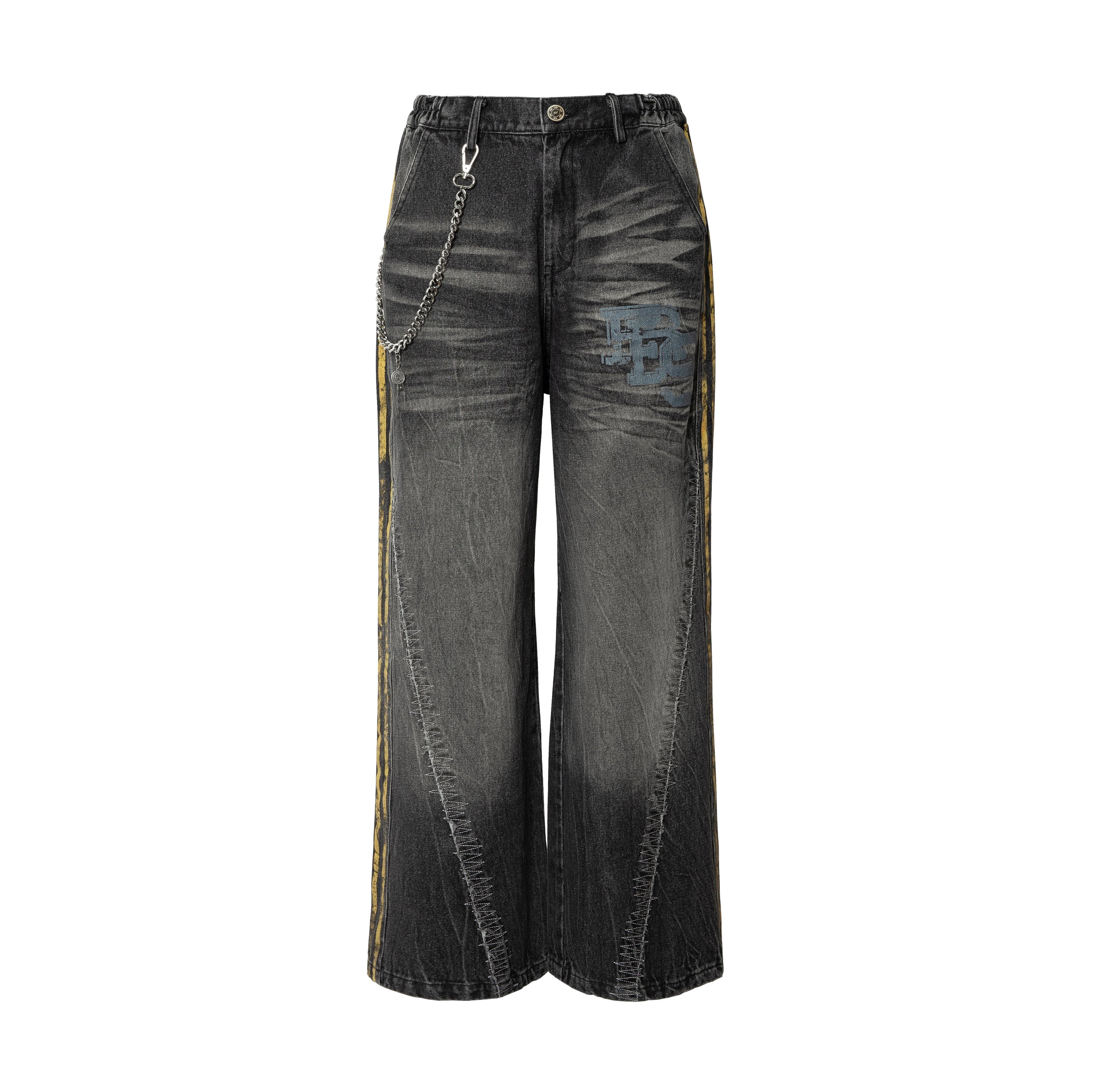 Front view of black washed barrel-leg denim jeans with yellow side stripes, blue logo patch, and detachable silver chain