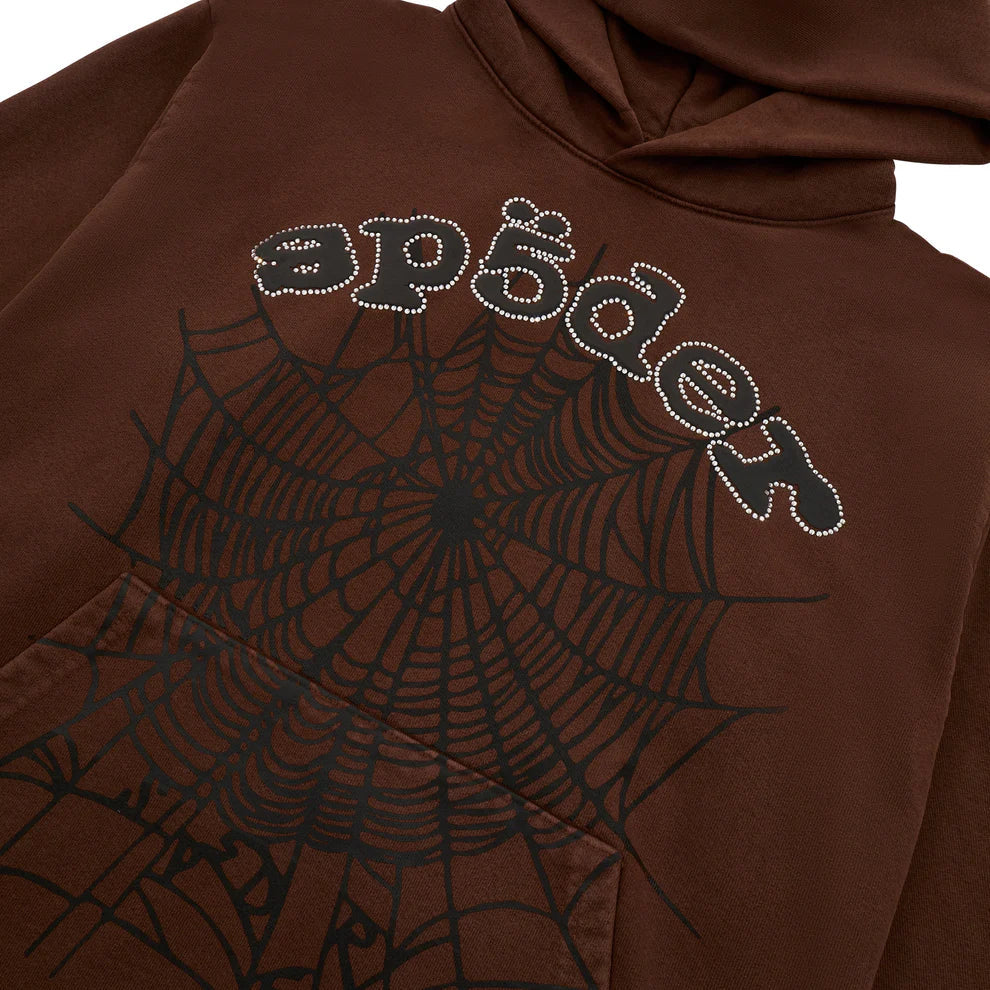 The Sp5der Web Hoodie – Mocha Brown 440GSM Heavyweight Streetwear Pullover features a bold black web graphic and "sp5der" text on mocha brown, finished with sparkling rhinestones for eye-catching style.