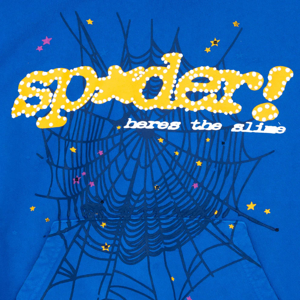 Royal blue hoodie with a large black spider-web graphic, yellow and white “Sp5der Hares the Slime” text, scattered yellow and pink stars. Crafted from heavyweight 440GSM cotton fleece for bold streetwear style and comfort.