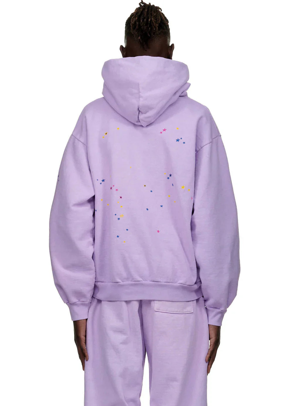 Person seen from the back wearing a Sp5der "Hares the Slime" Hoodie—Lavender Purple 440GSM Heavyweight Spider-Web Streetwear Pullover with matching pants, hood up, set against a plain white background. Features small colorful dot patterns.