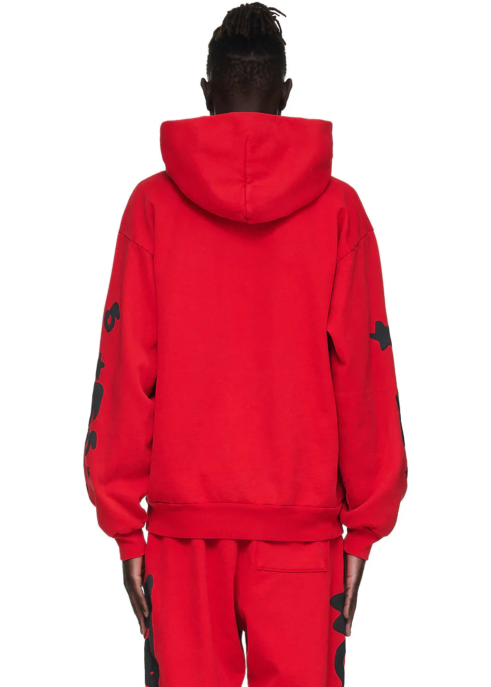 A person with short, twisted hair is seen from the back in a Sp5der “Starfire” Hoodie – Red & Black 440GSM Heavyweight Oversized Streetwear Pullover and matching red sweatpants, exuding Y2K streetwear vibes against a plain white background.