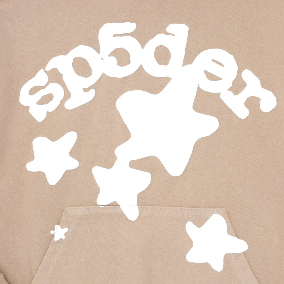 The Sp5der Star Hoodie – Brown & White 440GSM oversized pullover features heavyweight cotton fleece, bold white cartoon-like stars, and “sp5der” stylized in white text across the chest above a kangaroo pocket.