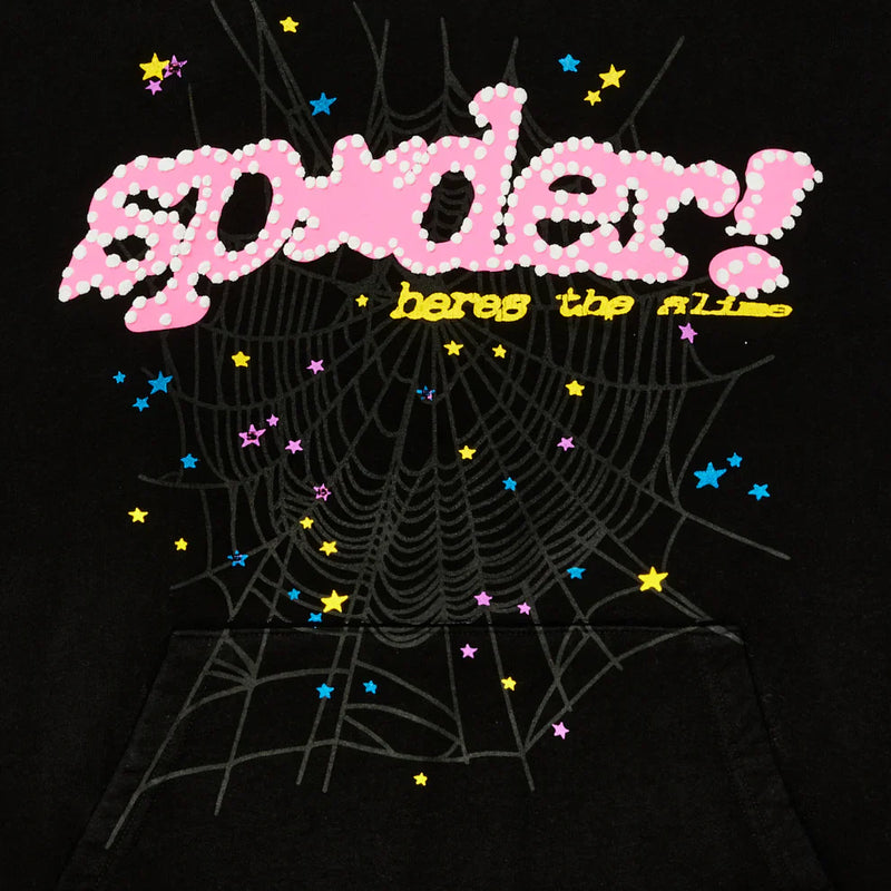 The Sp5der “Hares the Slime” Hoodie features pink polka dot "spider!", yellow "heres the fl1p", a gray spiderweb, and scattered stars on black heavyweight 440GSM fleece—a standout streetwear pullover.