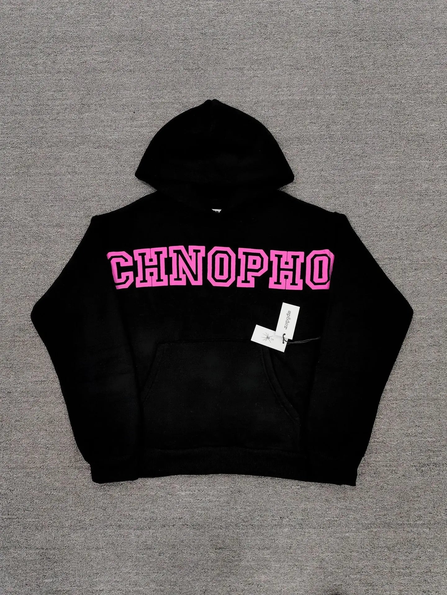Sp5der Arachnophobia black pullover hoodie with pink varsity letter graphic on chest