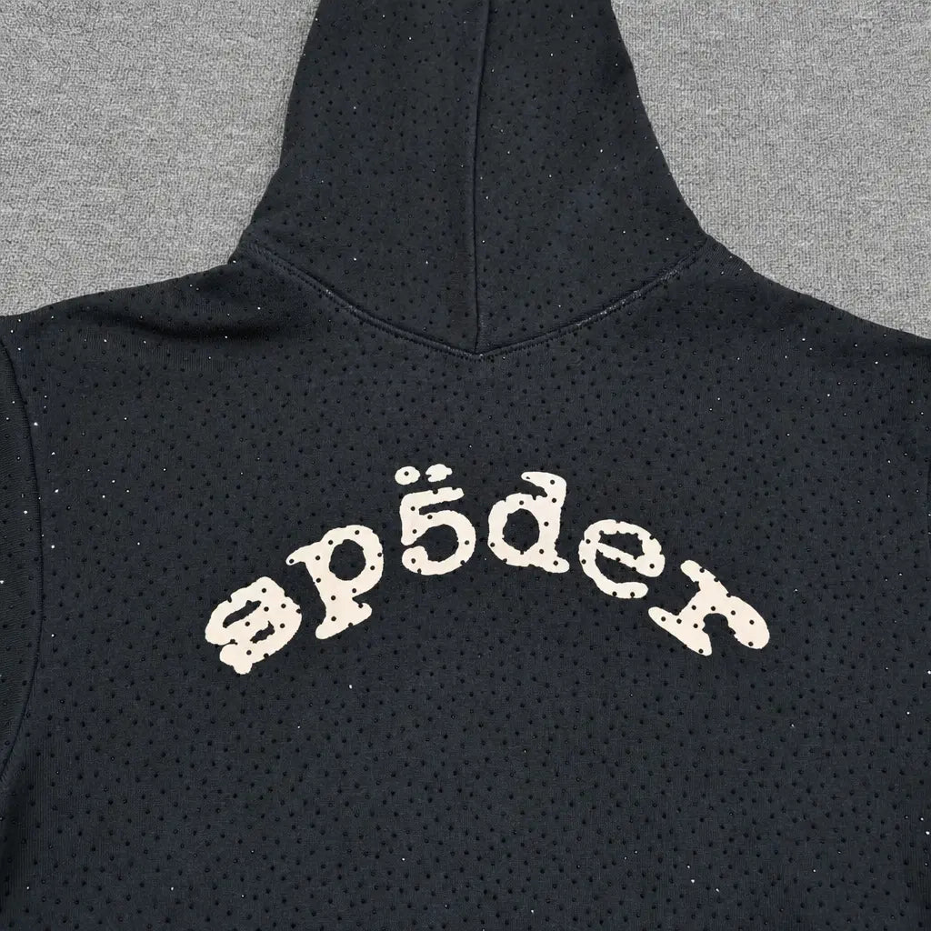 The Sp5der Black Rhinestone Hoodie features a cream arch logo across the back, subtle rhinestone embellishments, small dotted patterns, and is made from cotton—a standout piece in any streetwear collection.