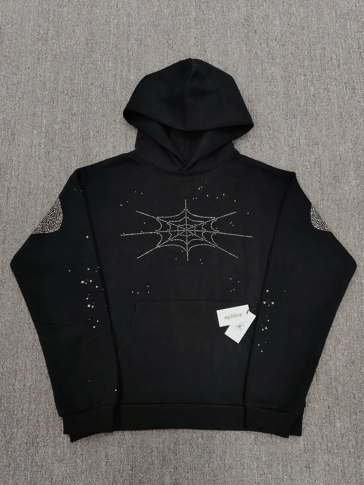 Sp5der black hoodie with silver rhinestone spiderweb and crystal embellishments on chest and sleeves
