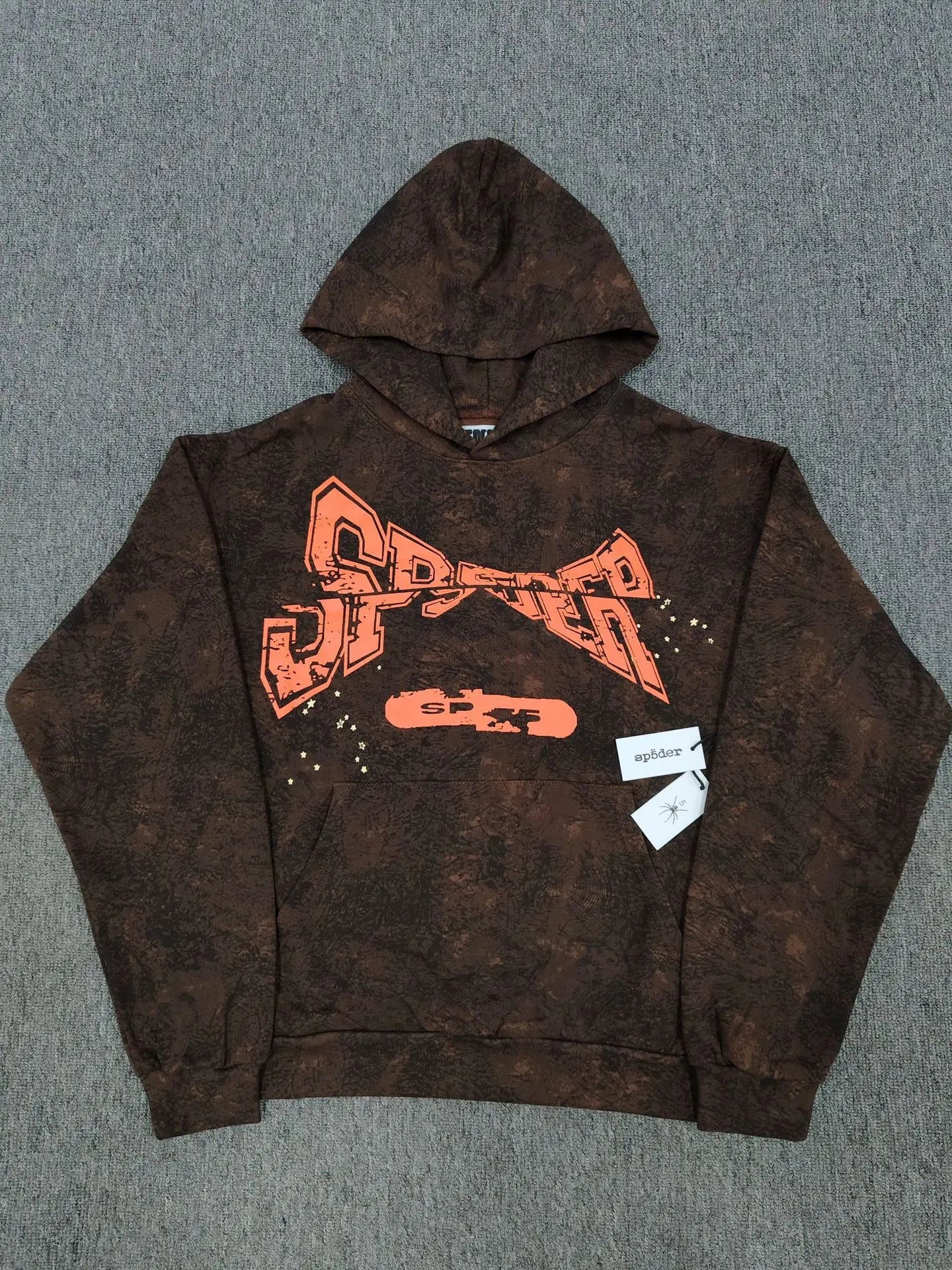 Sp5der brown tie-dye pullover hoodie with orange graphic logo print on the chest