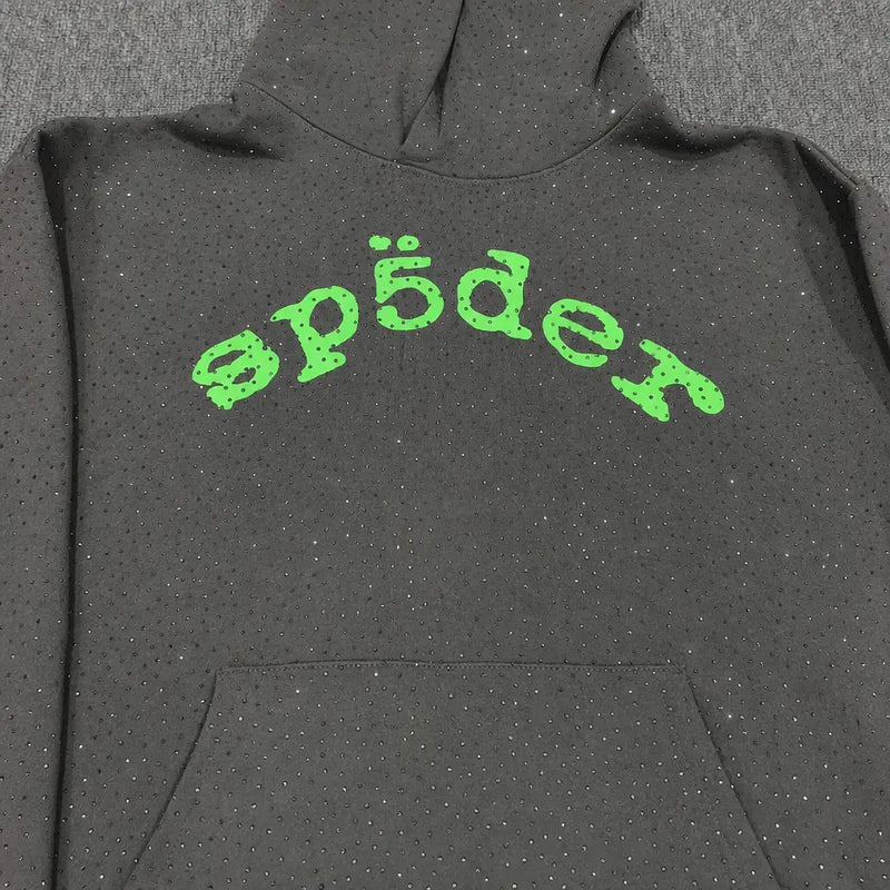 The Sp5der Dark Grey Rhinestone Hoodie Green Arch Logo features dark grey fabric, small sparkling rhinestones, and a bold green arch "sp5der" logo on the chest—an ideal streetwear piece.