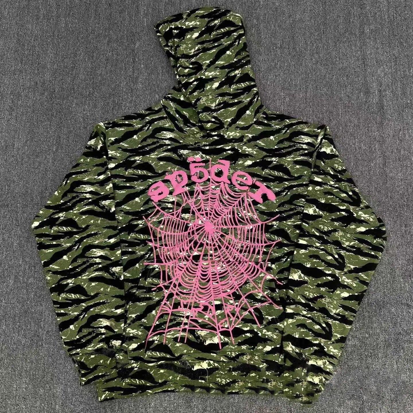 Sp5der green tiger camo pullover hoodie with pink spiderweb logo and sp5der lettering on the front