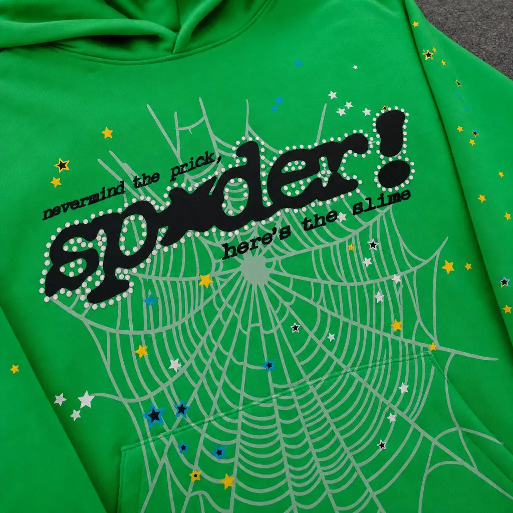 The Sp5der Neon Green Spiderweb Graphic Pullover Hoodie features a white spiderweb design, colorful stars, and bold black "nevermind the pricks, spider! here’s the slime" text—a standout piece for streetwear enthusiasts.