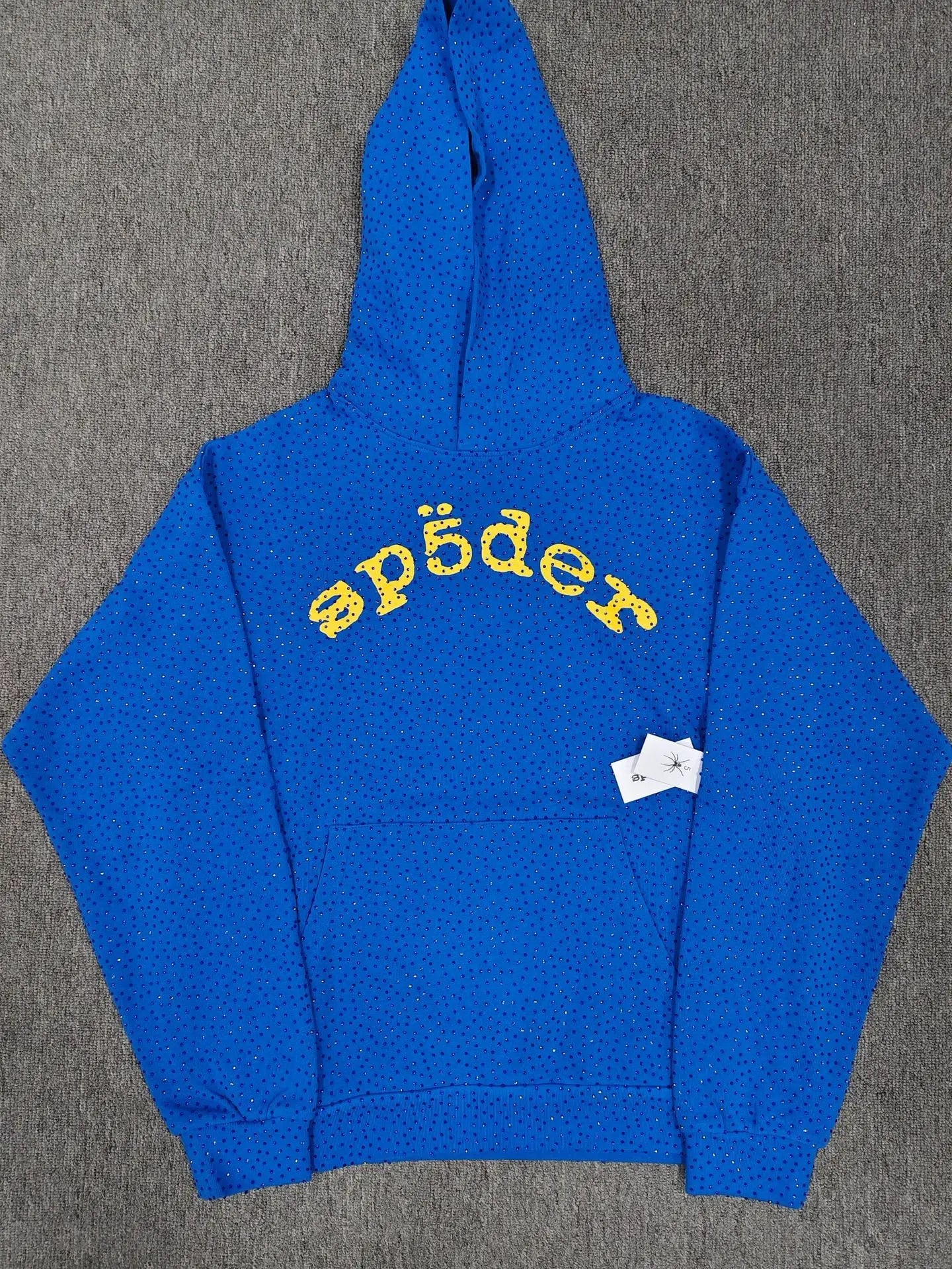 Sp5der royal blue pullover hoodie with all-over rhinestone detailing and yellow arch logo on chest