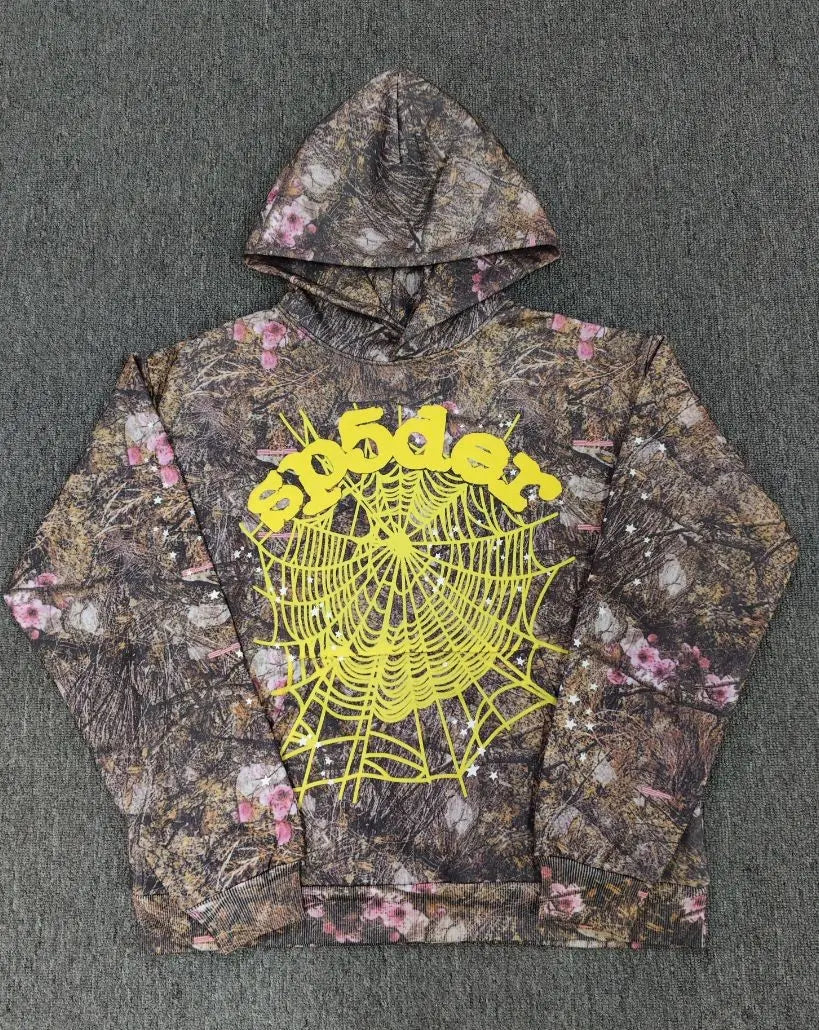 Sp5der woodland camo floral hoodie with yellow spiderweb graphic on the front chest