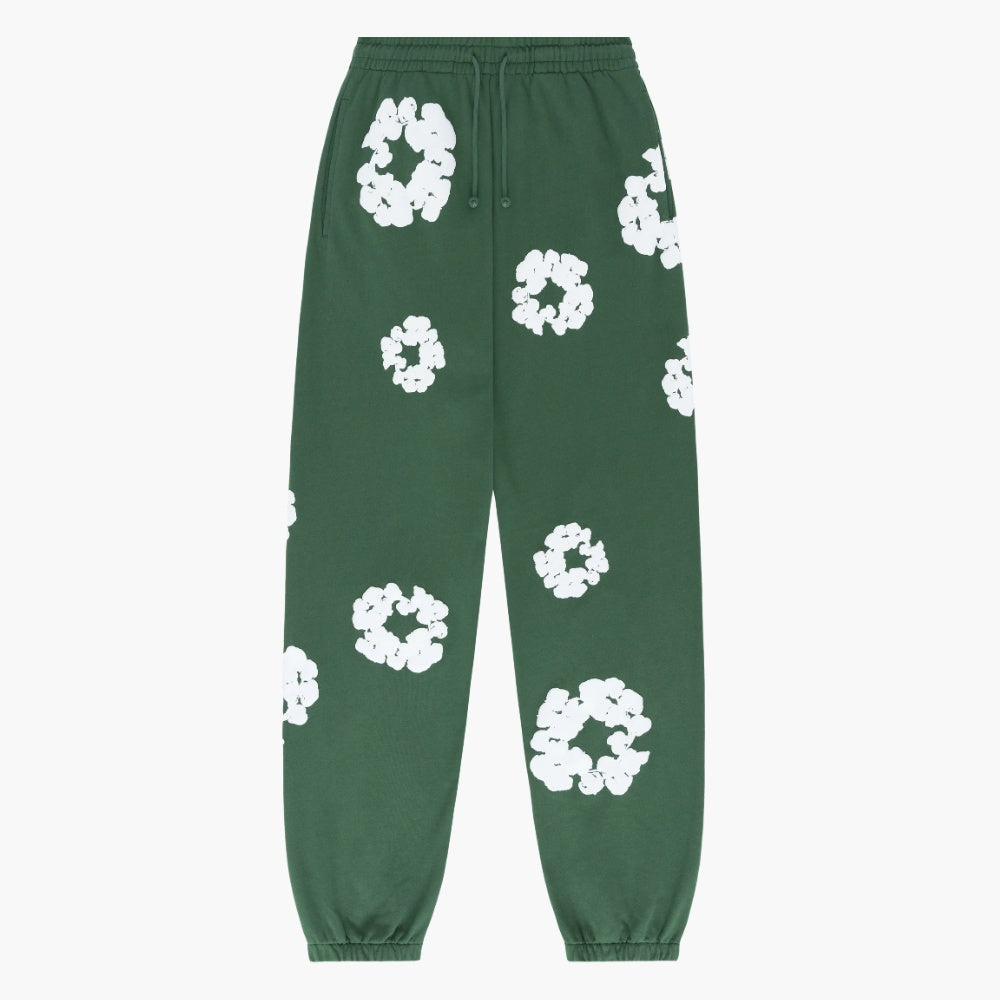 Forest Green “Cotton Wreath” Denim Tears Sweatpants feature an elastic waistband and cuffs, adorned with white floral prints—a signature streetwear design from Denim Tears.
